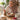 Lady eating breakfast porridge at table