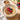 Talbina with fruits and nuts on top and some to side in bowls