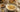 Talbina bowl with toppings and fruits and nuts to side