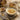 Talbina bowl with toppings and fruits and nuts to side